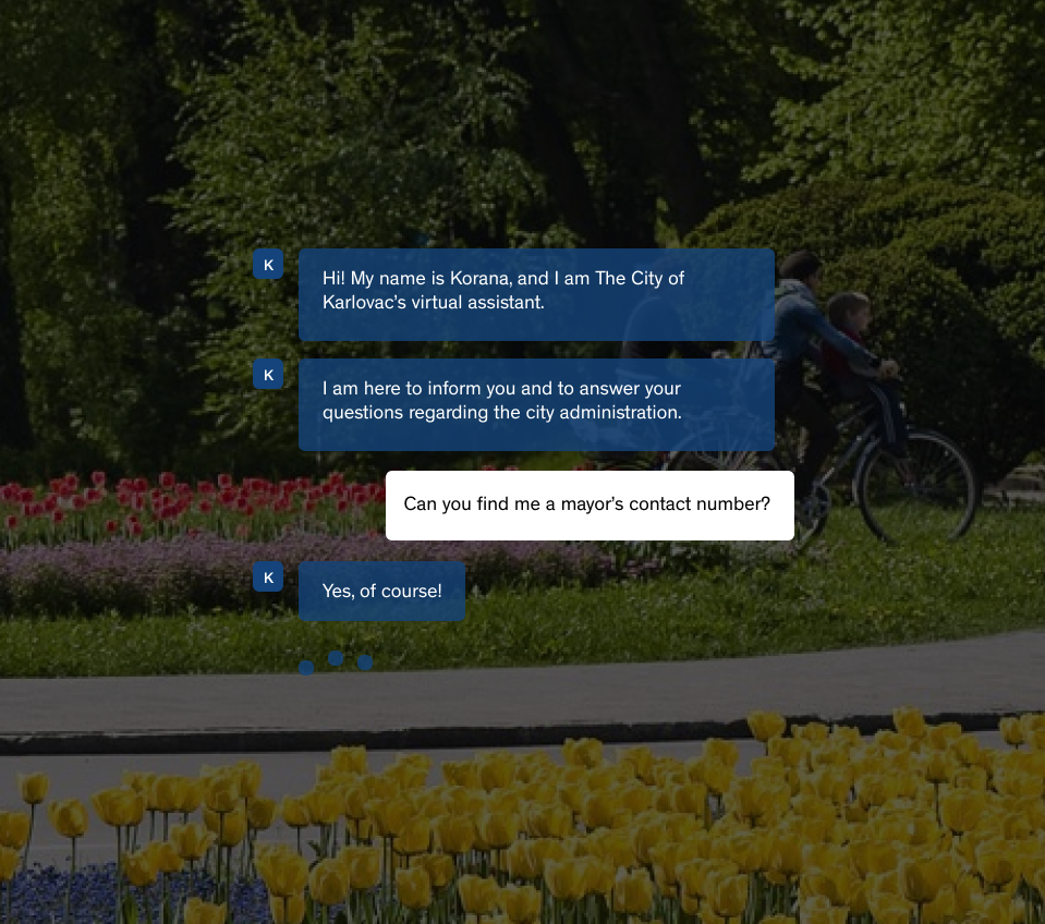 A park in the City of Karlovac with colorful flowers and a young family driving bicycles through it overlayed with an initiated chatbot conversation